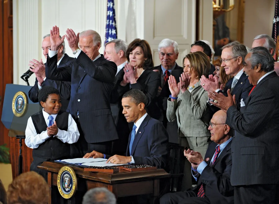 President Barack Obama signing the Affordable Care Act at the White House in 2010